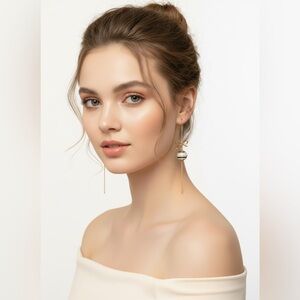 ✨ "Glamour in every sway — gold bow drop earrings add elegance to any outfit!" 💫